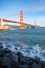Surf in front of Golden Gate Bridge worldwide known symbol of California
