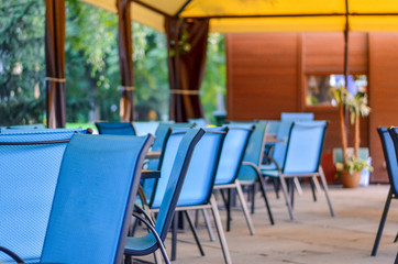 Blue chairs in outdoor cafe