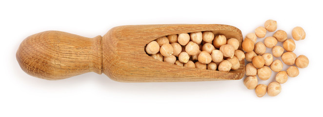 Dry raw organic chickpeas in wooden scoop isolated on white background. Top view