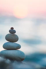 Poster stack of zen stones on pebble beach © Wingedbull