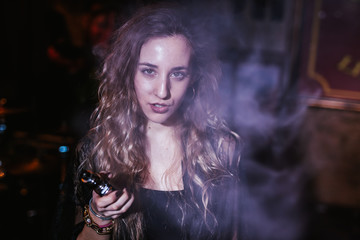 Young girl to vape in the disco