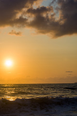 Amazing sea sunset, the sun, waves, clouds