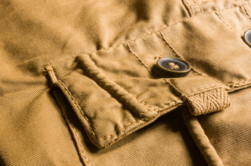 clothing items washed cotton fabric texture with seams, clasps, buttons and rivets