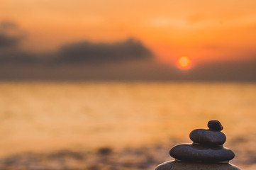 stack of zen stones on pebble beach