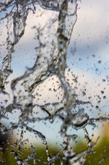 transparent falling water vertical flows, close up