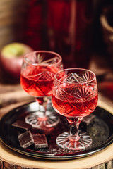 Homemade berry alcoholic beverage and chocolate