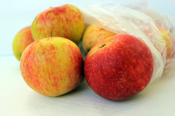 apples are packed in a transparent bag. The concept of healthy eating.