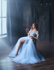 majestic and proud princess girl in white chic oriental blue dress tired sitting on chair, lady...