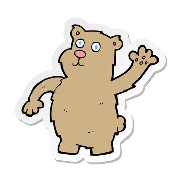 sticker of a cartoon waving bear
