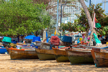 Fototapeta na wymiar Boats sitting on a beach in Thailand