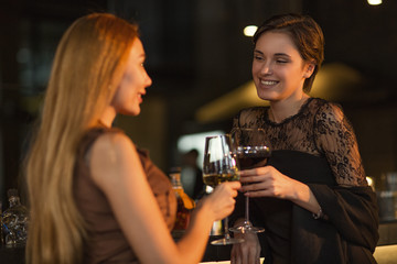 Beautiful women enjoying drinks at the bar