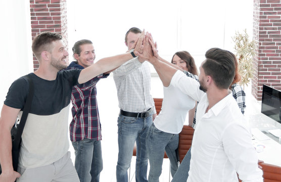 design team giving each other a high five