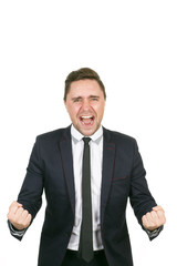 Emotional business. Mature devastated businessman screaming holding his fists