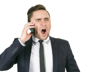 Shocking news. Closeup studio portrait of a shocked businessman talking on the phone copyspace on the side