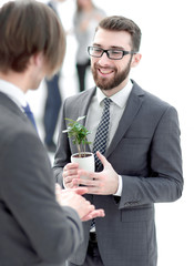 successful young businessman with young sprout