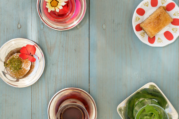 traditional Turkish red black tea tulip glass green flowers sweet dessert afternoon tea break