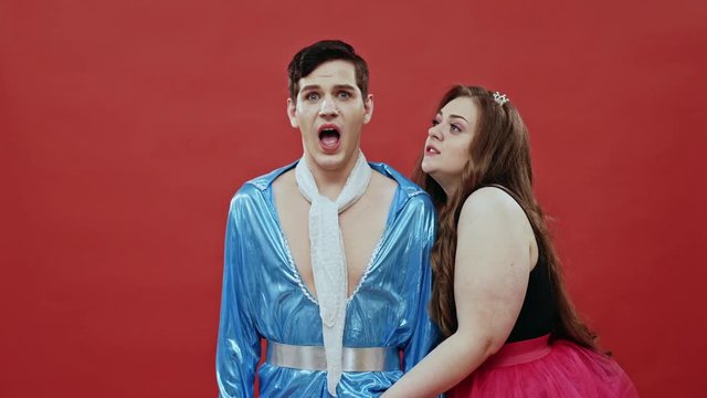 Young actors playing funny seducing scene