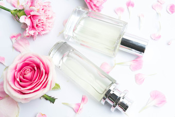 Perfume bottles on pink background