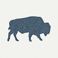 Bison icon silhouette. Retro letterpress effect. Buffalo symbol with sunbursts isolated on white background. Use for steak house logo, logotype. Vector design.. - Vector