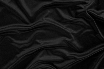 Abstract background. luxury cloth or liquid wave or wavy folds.Black satin fabric texture wallpaper.