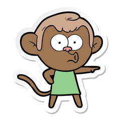Fototapeta premium sticker of a cartoon pointing monkey
