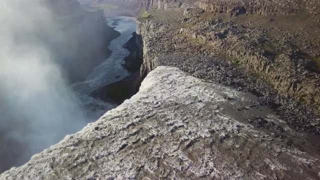 Aerial over Dettifoss, Iceland, one of the most remarkable waterfalls in the world, with rainbow.
