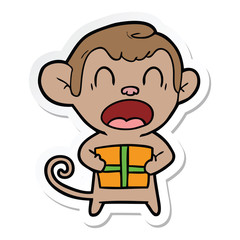 sticker of a shouting cartoon monkey carrying christmas gift