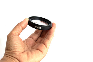 hand with lens on white background
