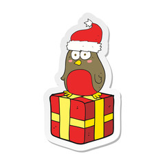 sticker of a cartoon robin on present