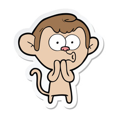 sticker of a cartoon hooting monkey