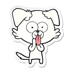 sticker of a cartoon dog with tongue sticking out