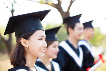 smiling asian young woman at graduation