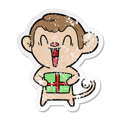 distressed sticker of a cartoon laughing monkey