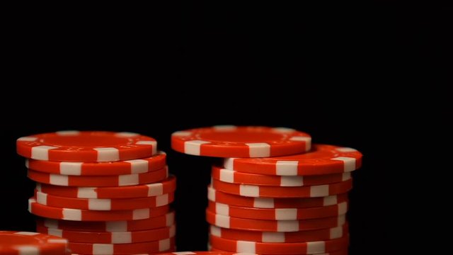 Woman putting poker chip in row, luxury casino club, gambling addiction, luck