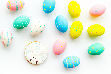 Easter symbols. Colorful Easter eggs and gingerbread on white background