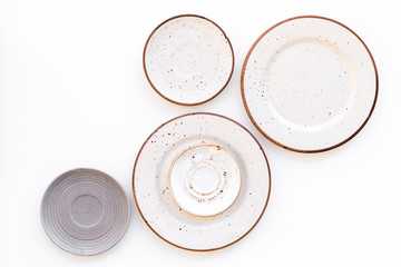 Ceramic plates pattern on white background top view space for text