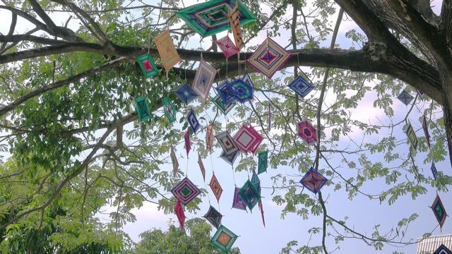 Decorative Mobile Spider web weaving hanging on tree