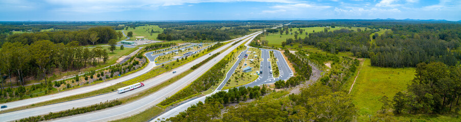 Wide aerial panorama of Clybucca Rest Area on Pacific Highway and countryside. Collombatti, New South Wales, Australia - 252748330