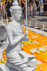 The mythological figures of the Hindu religion. The statues of God Devata - Deity, Flower festival, Bangkok, Thailand.