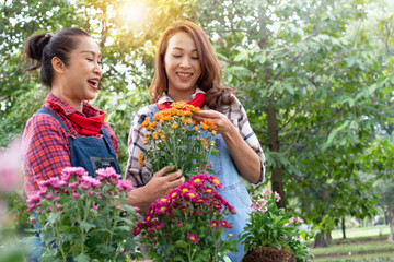 Mom and her daughter have fun in the work of gardening