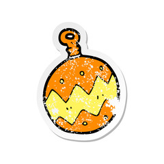 retro distressed sticker of a cartoon christmas bauble