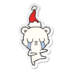 crying polar bear sticker cartoon of a wearing santa hat