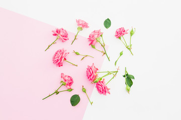Pink and white background with pink flowers. Flat lay. Top view