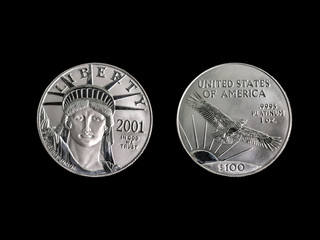 1oz Platinum 100 dollar coin on a black background.