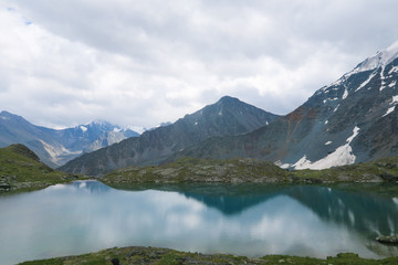Fototapeta na wymiar Mountain mirror crystal clear lake. Valley of 7 lakes. Altai Mountains, Russia
