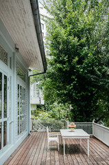 Oriental vintage home with outdoor wooden furniture in old house balcony