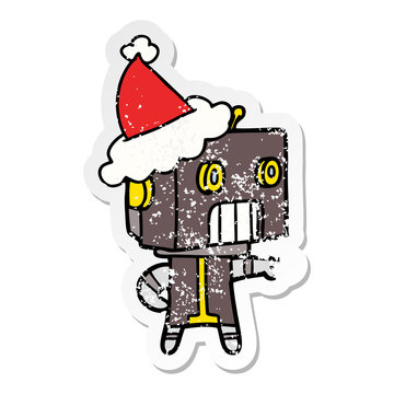 distressed sticker cartoon of a robot wearing santa hat