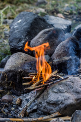 Flame of the bonfire and stones