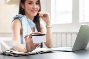 Freelancer business woman holding credit card