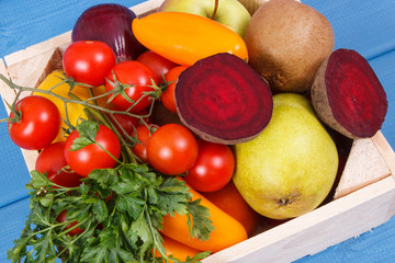 Fruits and vegetables in wooden box. Healthy nutrition, slimming and dieting concept